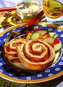 Pizza snails with salami and tomatoes