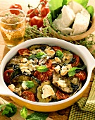 Aubergine and tomato casserole with cheese and fresh mint
