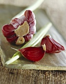 Red garlic on a stone plate