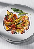 Shrimps with bacon, fried courgettes and sage