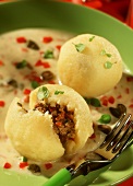 Mince dumplings with caper sauce