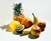 Exotic fruits, apple and peach on a white background