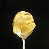 Clarified butter on a spoon