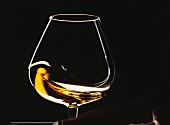 Swirling cognac in a glass