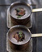 Lentil soup with fried rabbit liver in copper pans