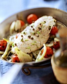 Pan-cooked fish dish with tomatoes, fennel and capers