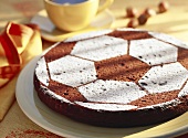 Whole football cake with icing sugar decoration