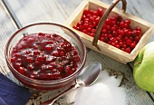 Cranberry jam with apple in glass bowl