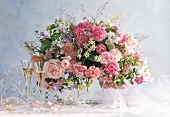 Festive bouquet of roses and meadow flowers; champagne