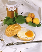 Roll with butter and apricot jam