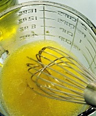 Beating vinaigrette with a whisk