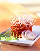 Tuna tartare with red lentils and onions