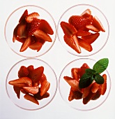 Fresh strawberries in glass bowls