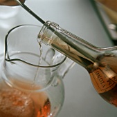 Decanting wine with cork remains into carafe