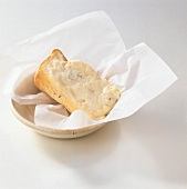 Gorgonzola on paper in a bowl