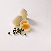 Hard-boiled eggs and several capers