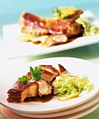 Chine of suckling pig with honey glaze & cabbage & apple salad