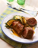 Pork roulades with ham stuffing, courgettes & rosemary
