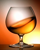 Swirling cognac in a glass