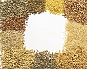 Various types of cereals arranged around edge of picture