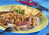 Meat and onion dish with cheese triangles (cut into)