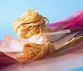 Home-made ribbon noodles on paper