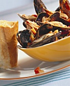 Mussels with tomatoes and baguette