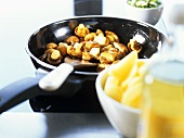 Sautéing chanterelles in frying pan