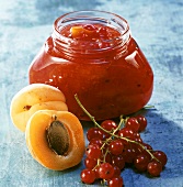 Apricot and redcurrant preserve in jar
