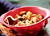 Hands holding basket of ceps