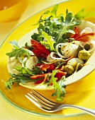 Rocket salad with mozzarella, peppers and olives