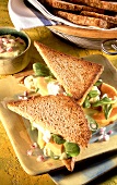 Avocado sandwiches with papaya and corn salad