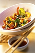 Pak choi with peppers and tofu in white bowl