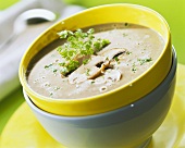 Creamed mushroom soup in yellow bowl