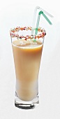 Nectarine buttermilk in glass with coloured sugar sprinkles