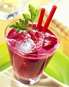 Savoury vegetable drink with beetroot juice and ice cubes