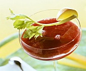 Beetroot drink garnished with celery and apple