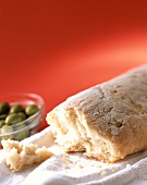 Italian white bread and green olives