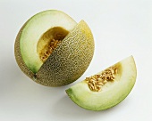 Galia melon, a piece cut off, and melon wedge
