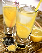 Green tea punch with lemon and ice cubes