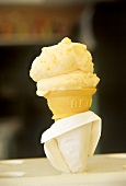 Ice cream cone with apricot ice cream