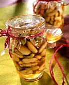 Honeyed almonds with pistachios in preserving jar