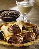 Crepes with chocolate mousse filling; mocha beans; coffee cream