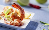 Fried shrimps with wedge of lemon on plate