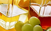 Two different types of fruit vinegar; green grapes