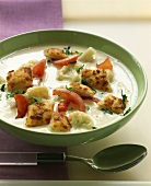Cauliflower soup with tomatoes and cheese croutons