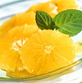 Oranges in honey with fresh mint