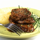Minute steaks with mashed potato and rosemary