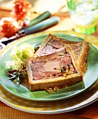Meat pie, with salad garnish
