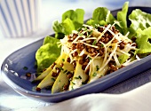 Lentils on raw celery salad with slices of pear